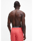 CALVIN KLEIN DOUBLE WAISTBAND SWIM SHORTS KM0KM00702_XKN - Coral Crush